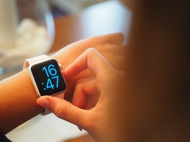 person checking their smartwatch
