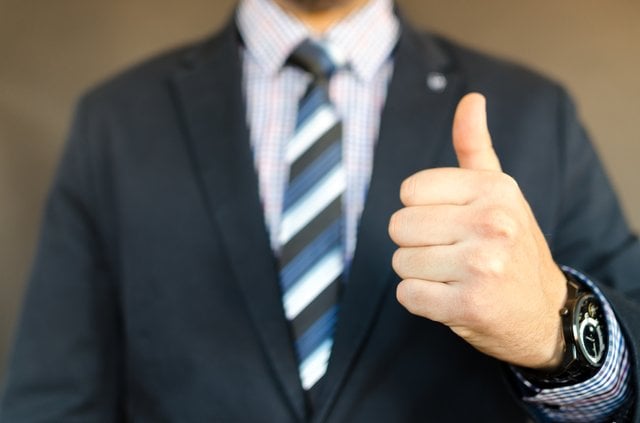 businessman thumbs up