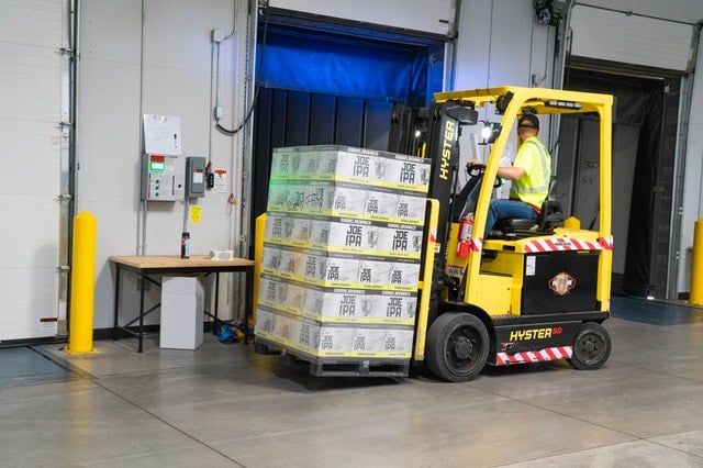 Man operating forklift