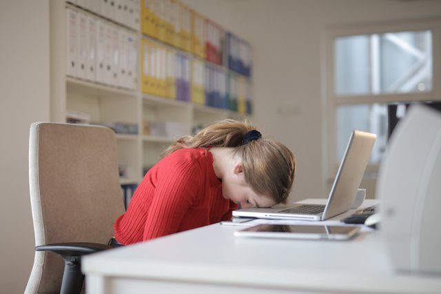 woman face down laptop