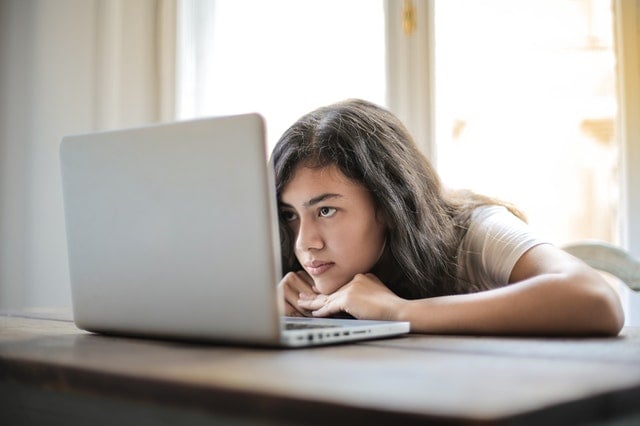 young woman using laptop