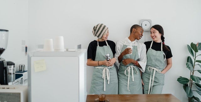 three persons talking